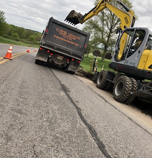 Excavator Pulls Dirt from Supply Truck