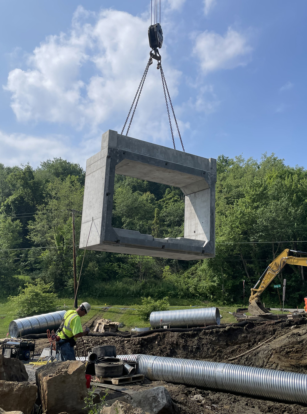 GUL_strtucture_2 Culvert section being moved by a crane at job site