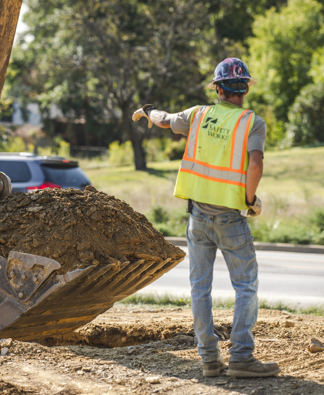 Gulisek-(9) Construction worker wearing a safety works vest on job site